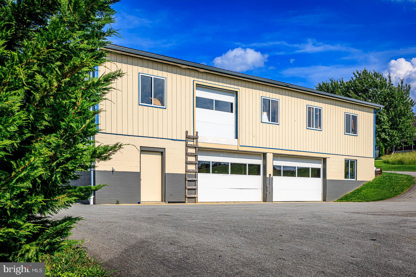 4360 Battlehill Road Brogue, PA 17309 - Photo 18 of 30 a front view of a house with a yard and garage