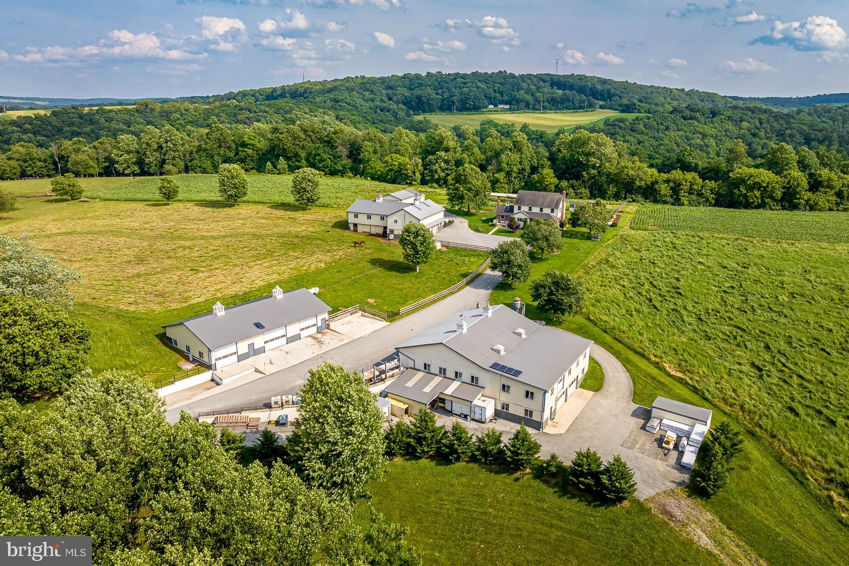 4360 Battlehill Road Brogue, PA 17309 - Photo 26 of 30 an aerial view of a house with a garden and lake view