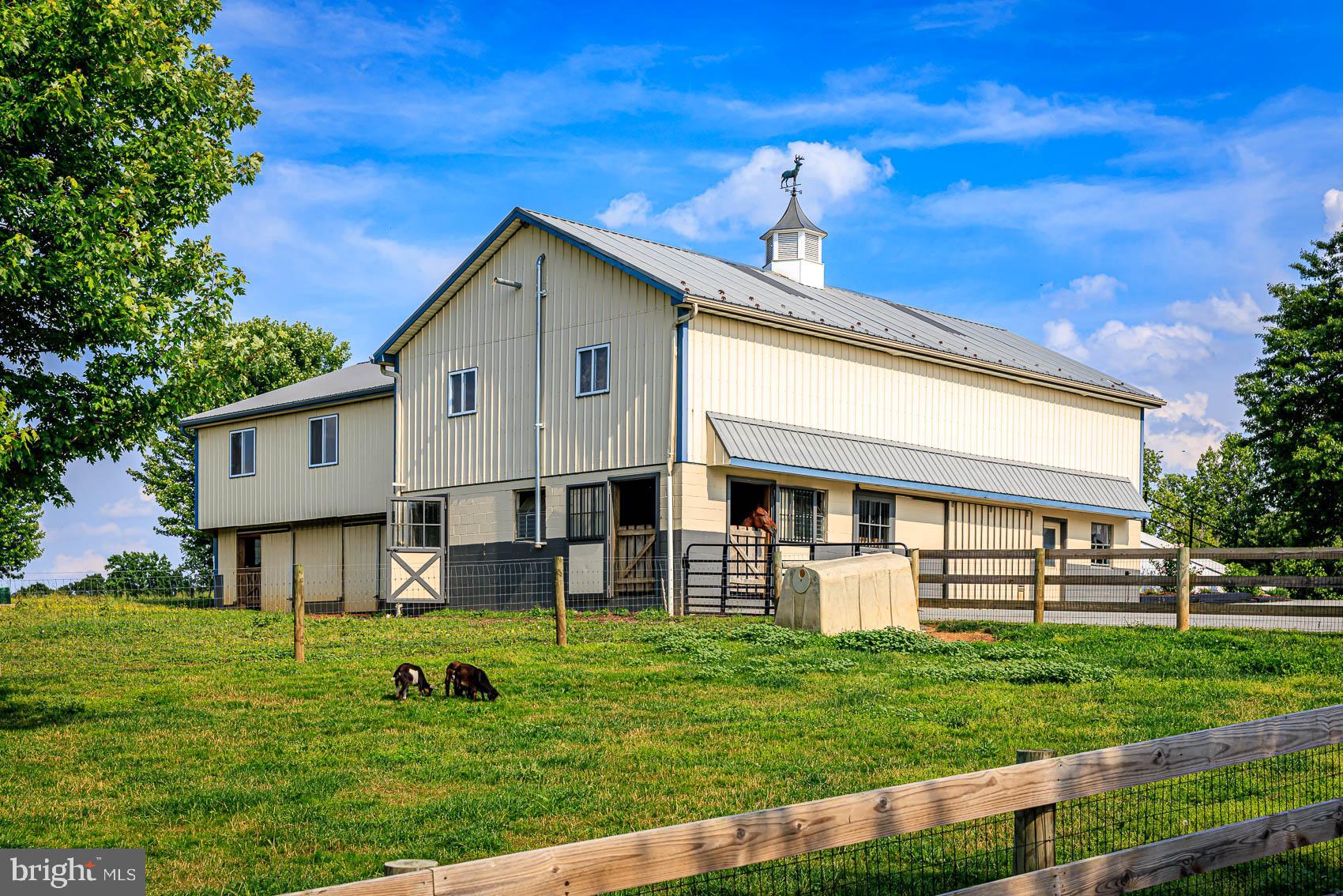 4360 Battlehill Road Brogue, PA 17309 - Photo 7 of 30 a front view of a house with a yard table and chairs
