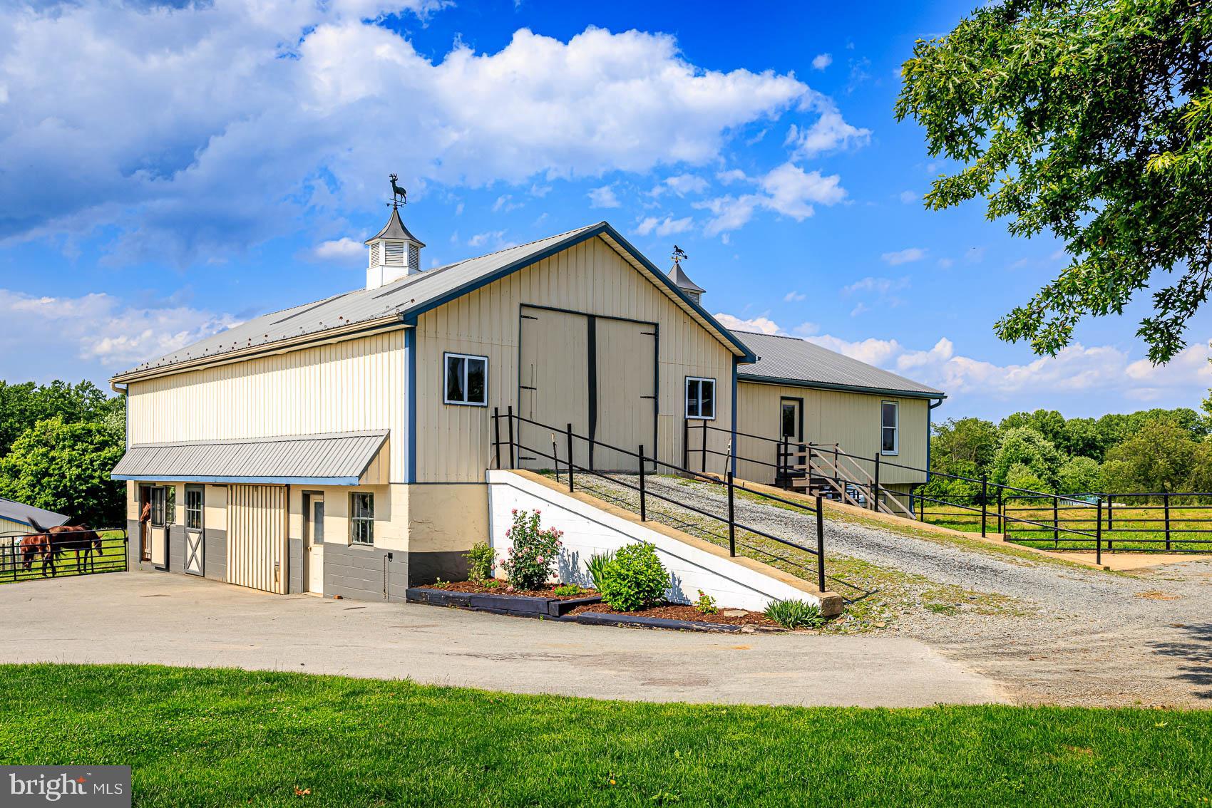 4360 Battlehill Road Brogue, PA 17309 - Photo 9 of 30 a front view of a house with a yard and garage