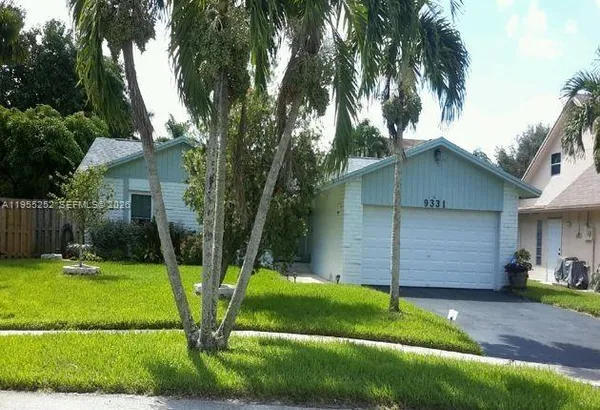a view of a backyard with a house