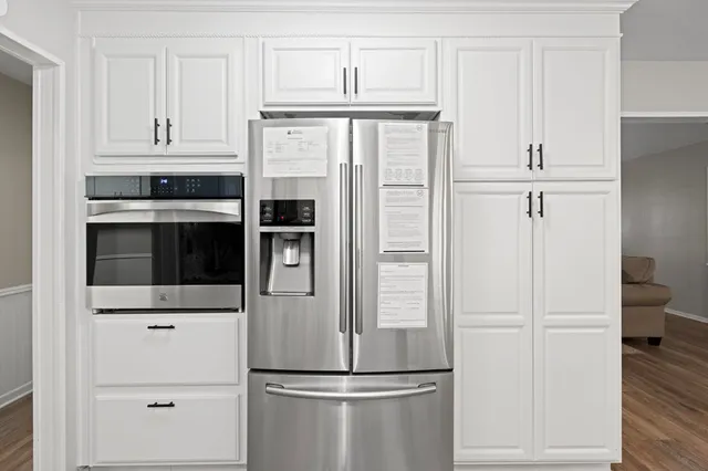 a kitchen with cabinets and stainless steel appliances
