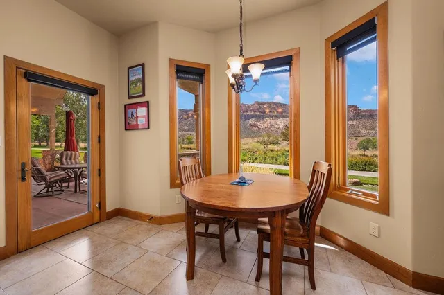 a view of a dining room with furniture window and outside view