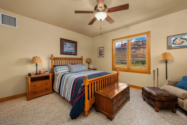 a spacious bedroom with a bed and a couch