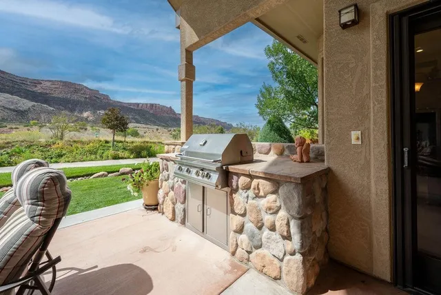 a patio with table and chairs