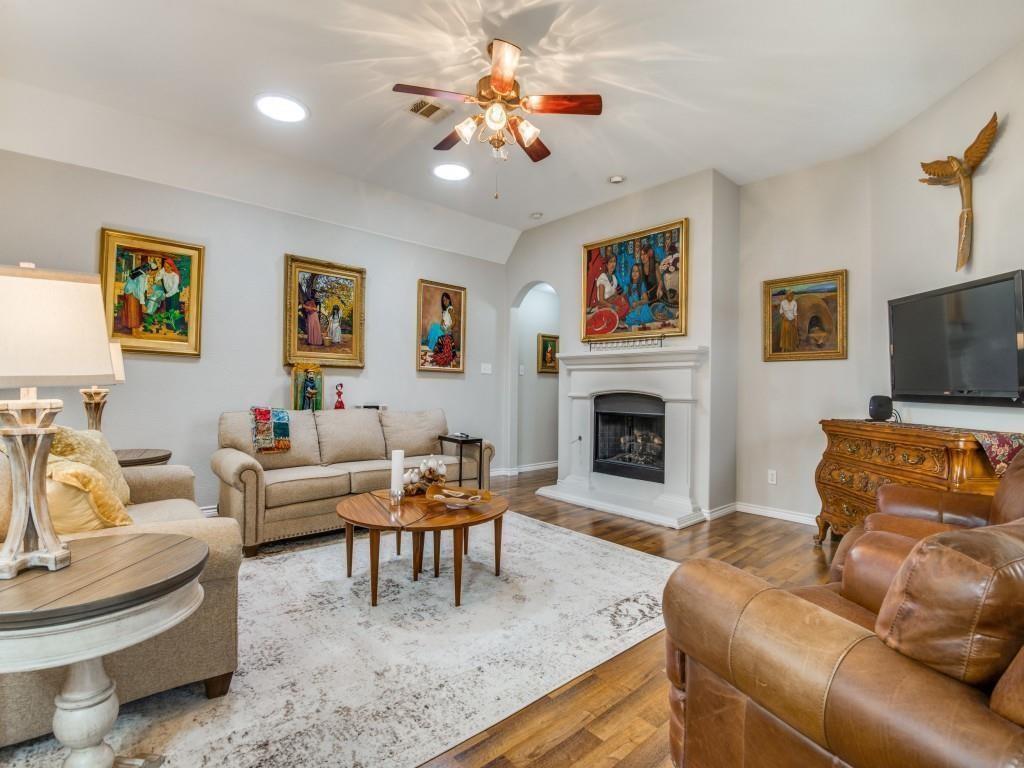 9962 Bell Rock Road Frisco, TX 75035 - Photo 11 of 28 a living room with furniture fireplace and a flat screen tv