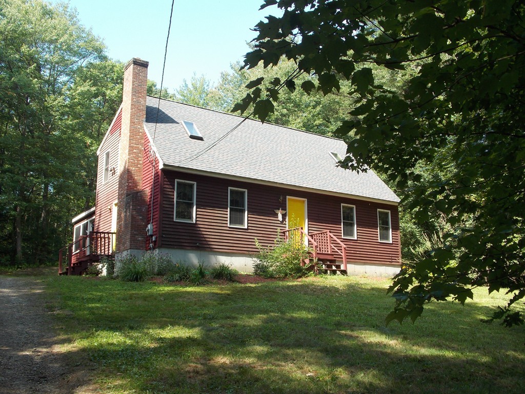 48 Simonds Hill Road Hubbardston, MA 01452 - Photo 1 of 25 a front view of a house with garden