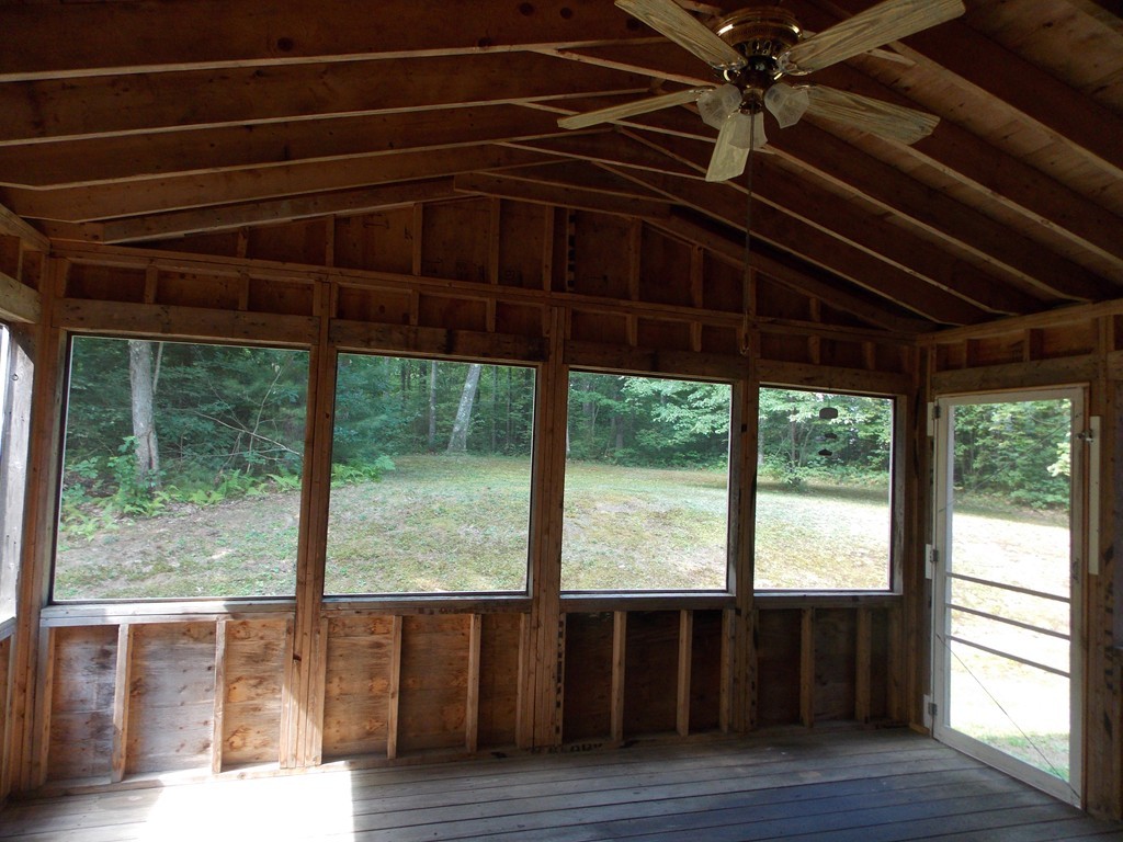 48 Simonds Hill Road Hubbardston, MA 01452 - Photo 4 of 25 a view of a room with wooden floor and outdoor view