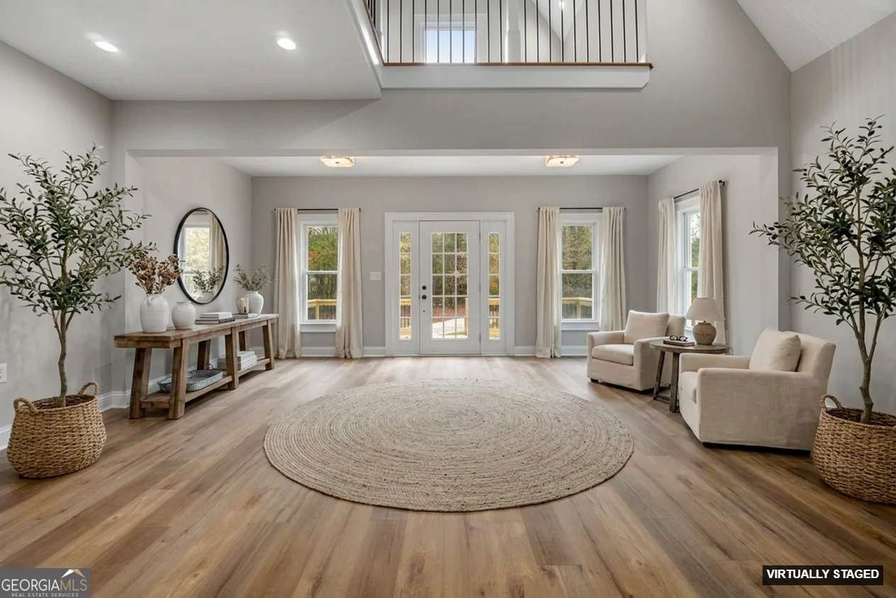164 I I Walker Brooks Road Newnan, GA 30263 - Photo 13 of 54 a living room with furniture a large window and potted plants