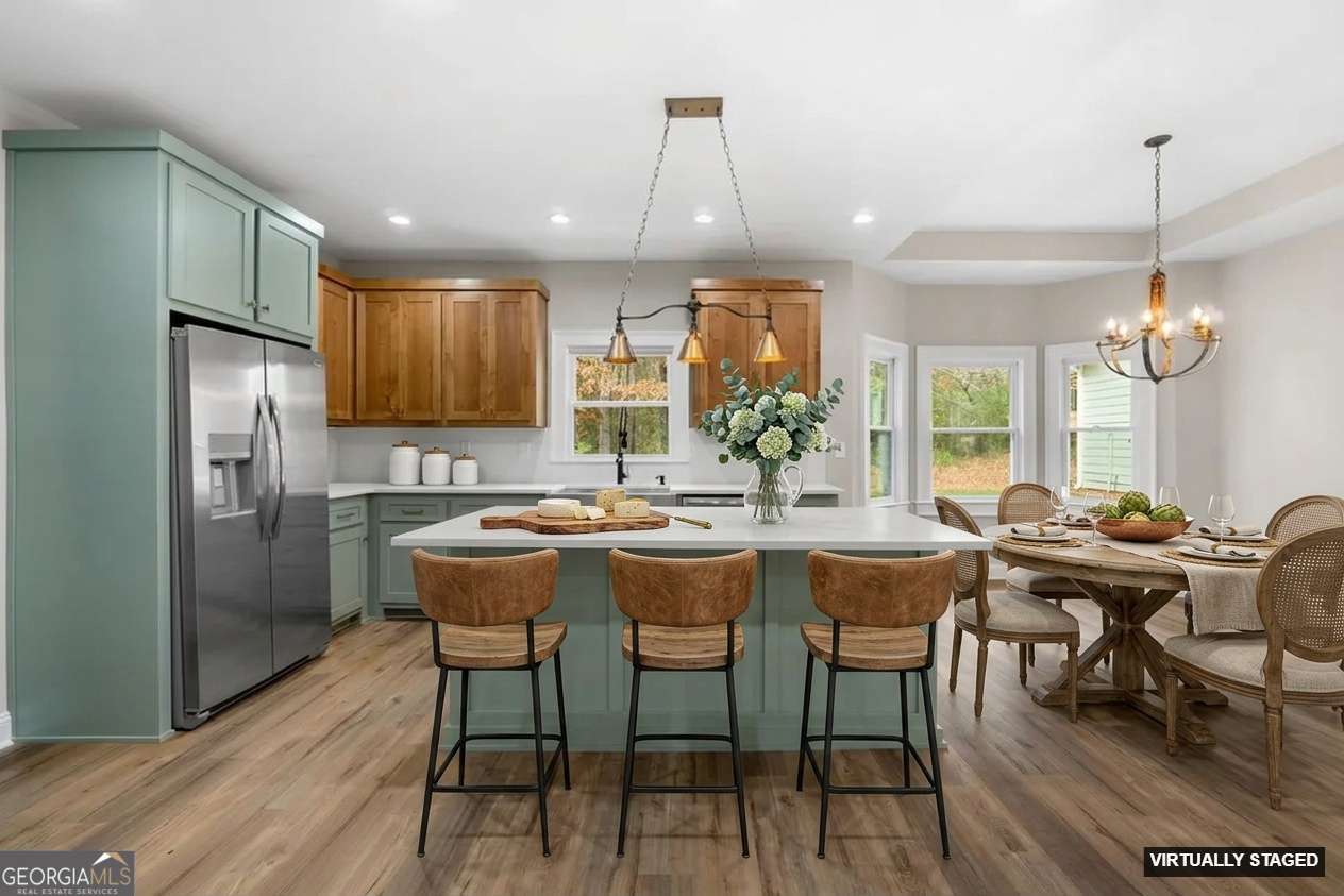 164 I I Walker Brooks Road Newnan, GA 30263 - Photo 20 of 54 a dining room filled chandelier and wooden floor