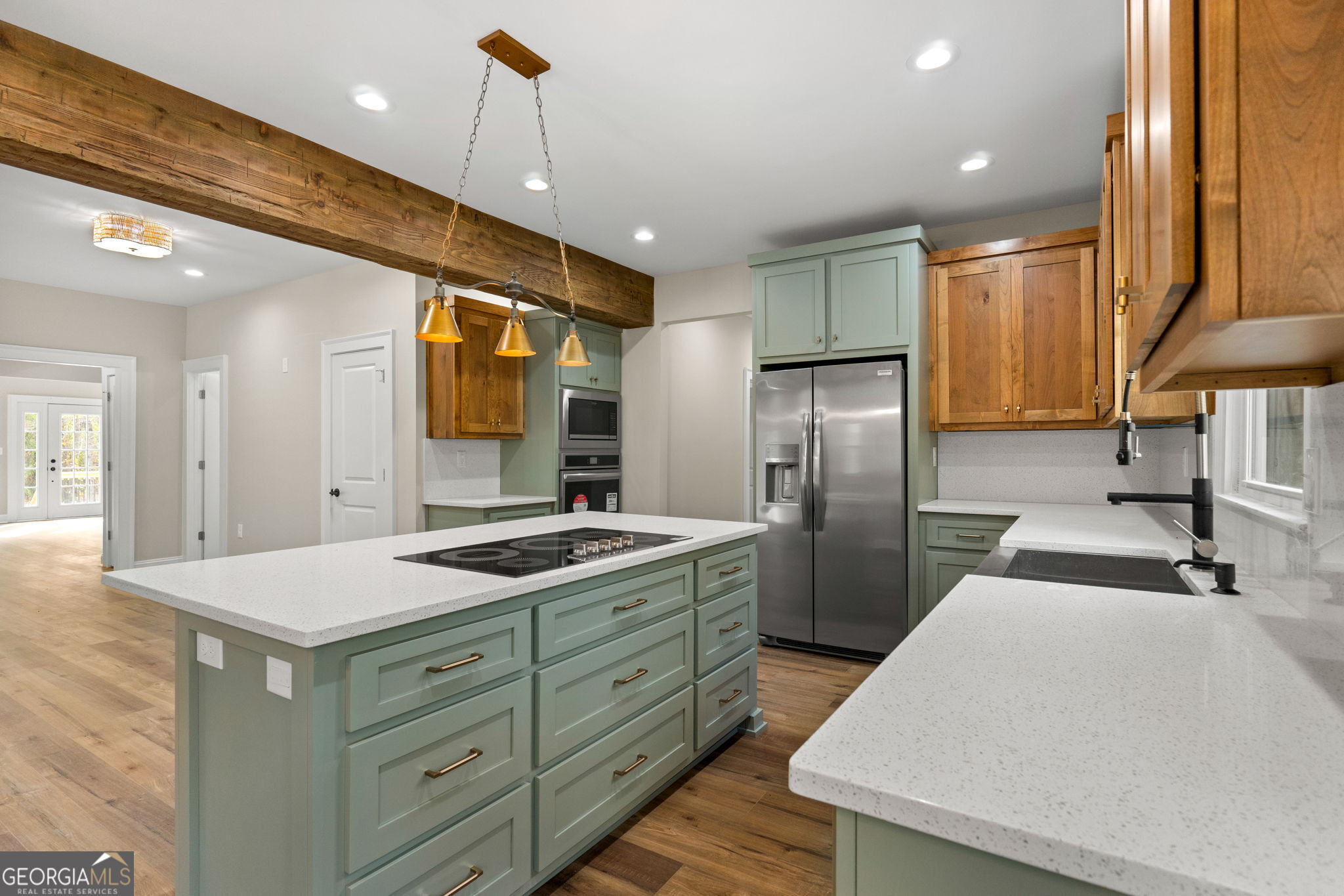 164 I I Walker Brooks Road Newnan, GA 30263 - Photo 23 of 54 a kitchen with stainless steel appliances granite countertop a sink a stove a refrigerator and a refrigerator