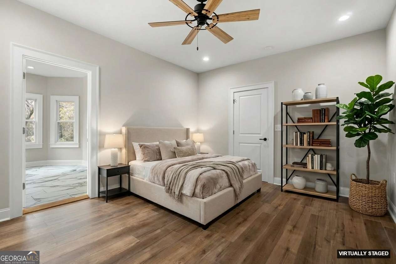 164 I I Walker Brooks Road Newnan, GA 30263 - Photo 28 of 54 a bedroom with a bed and a chandelier