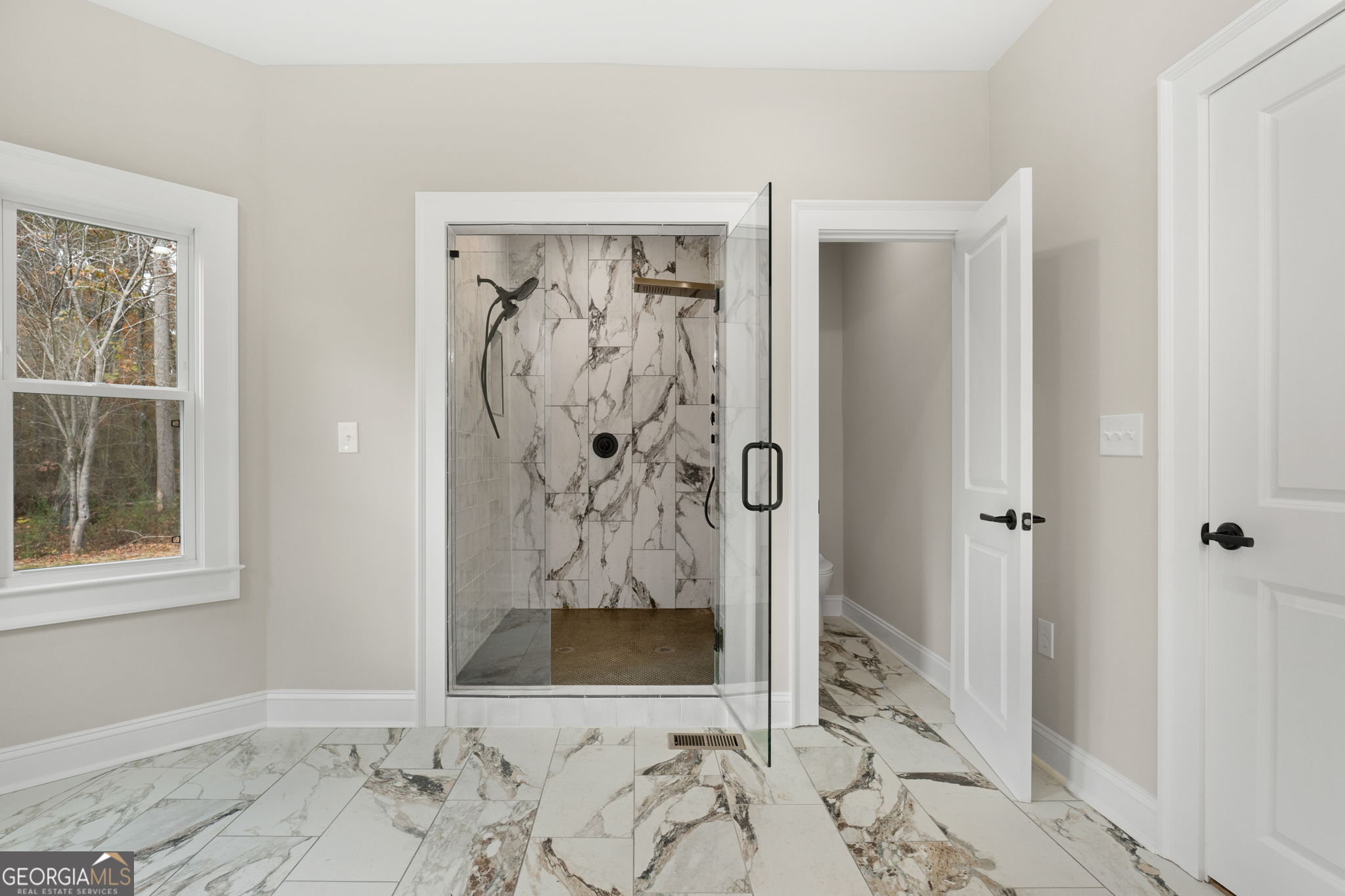 164 I I Walker Brooks Road Newnan, GA 30263 - Photo 31 of 54 a view of a bathroom with a shower and a sink