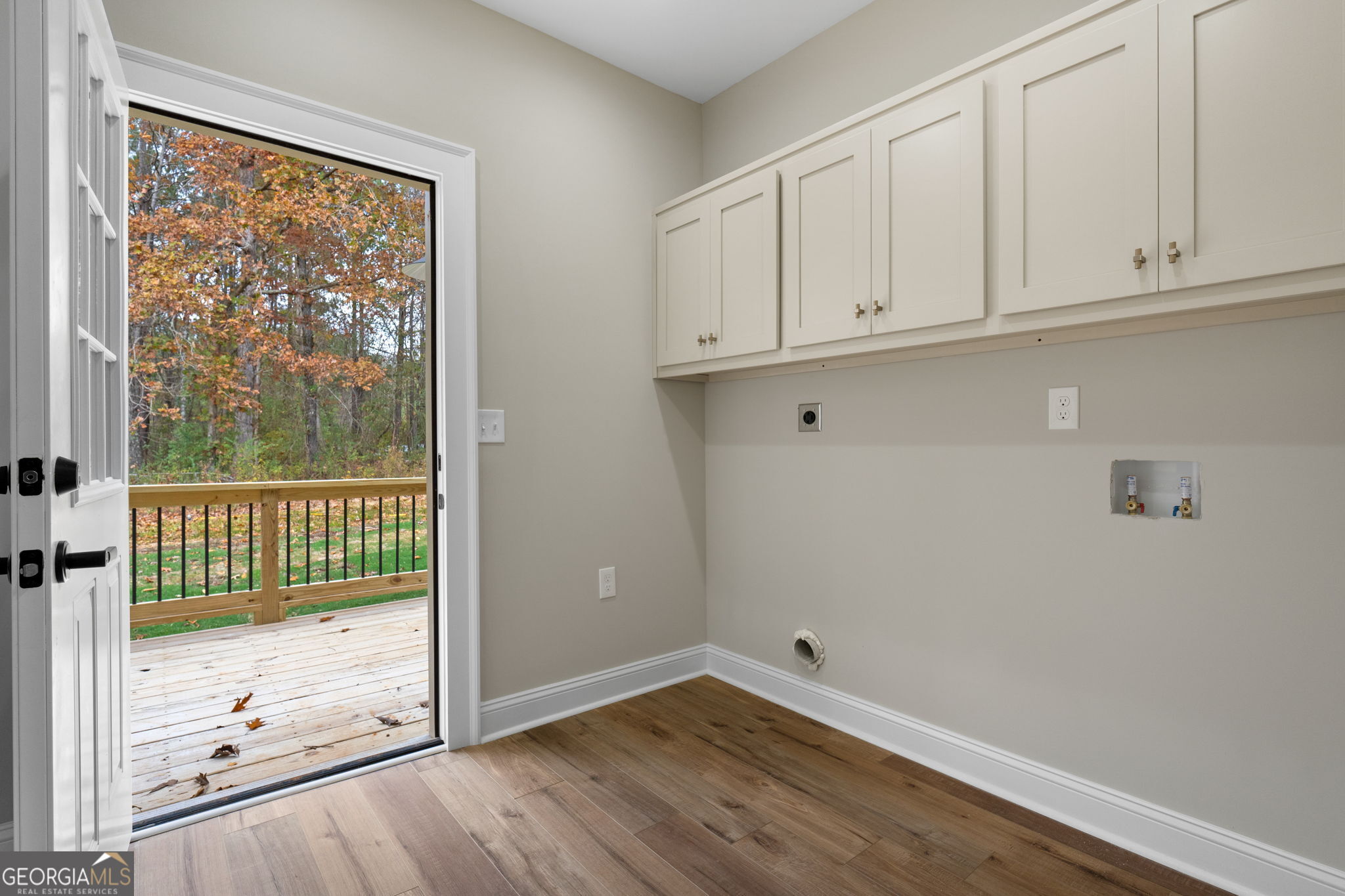 164 I I Walker Brooks Road Newnan, GA 30263 - Photo 37 of 54 an empty room with wooden floor and windows