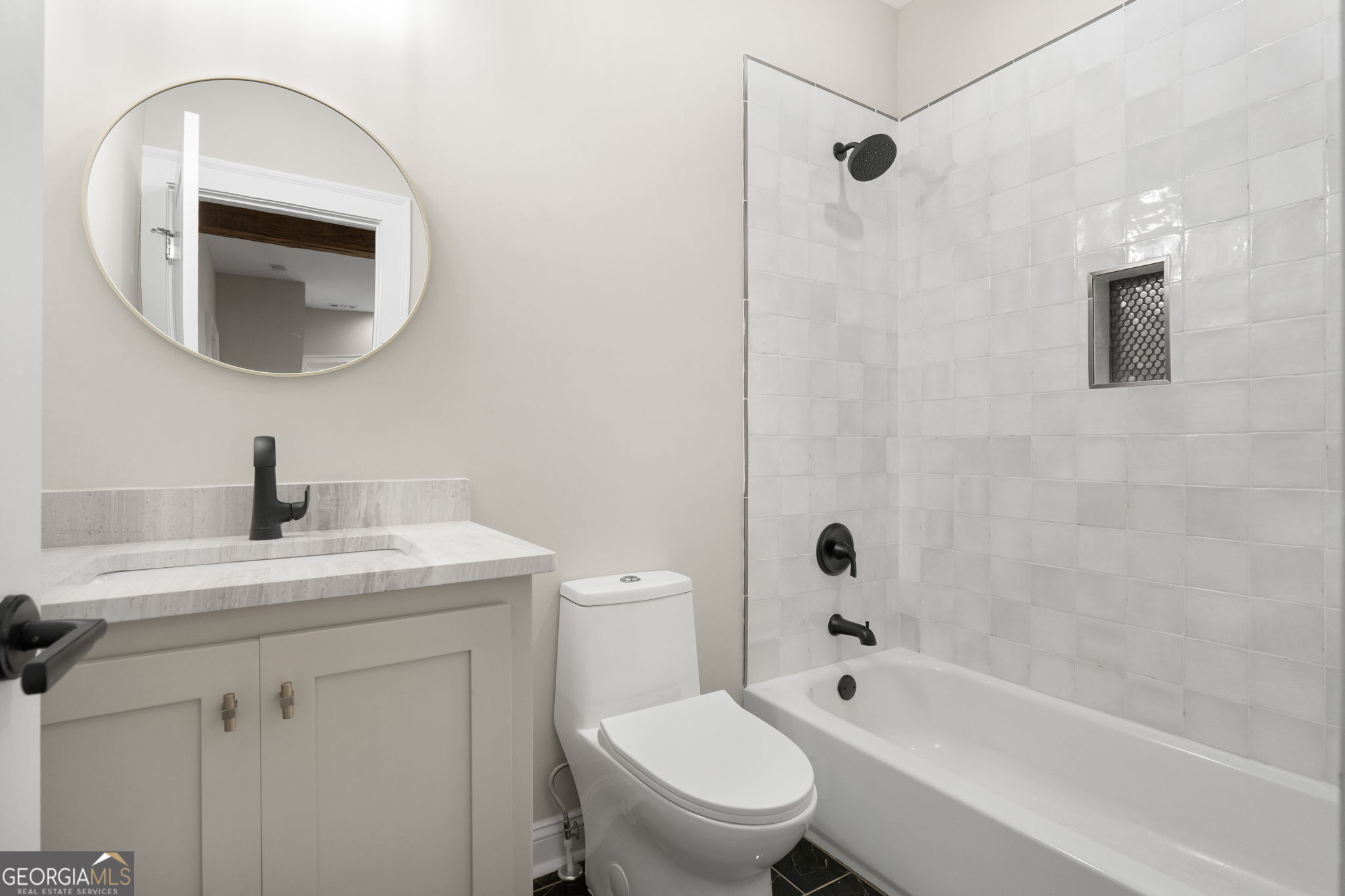 164 I I Walker Brooks Road Newnan, GA 30263 - Photo 41 of 54 a bathroom with a toilet a sink a mirror and vanity