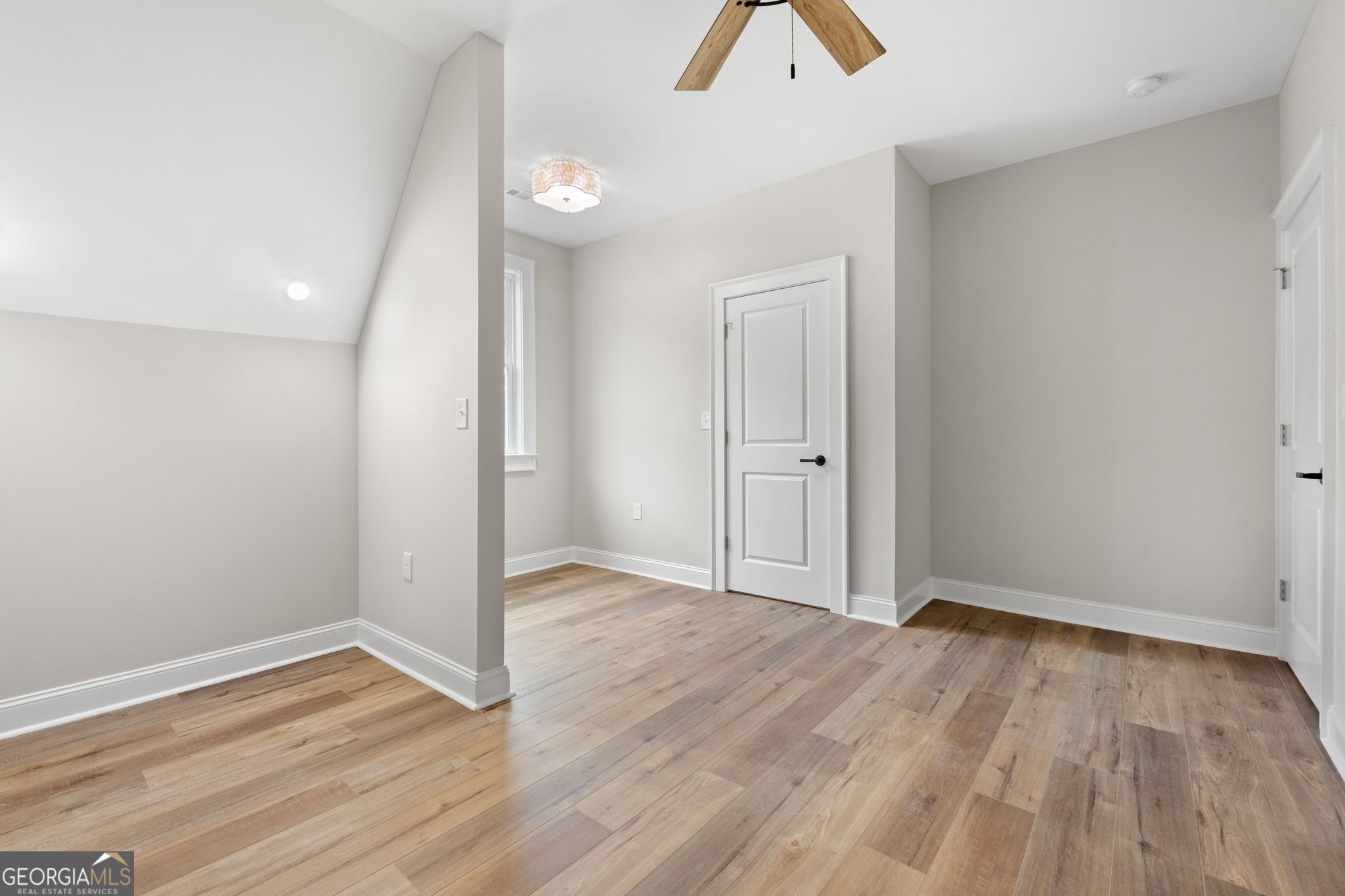 164 I I Walker Brooks Road Newnan, GA 30263 - Photo 46 of 54 an empty room with wooden floor and window