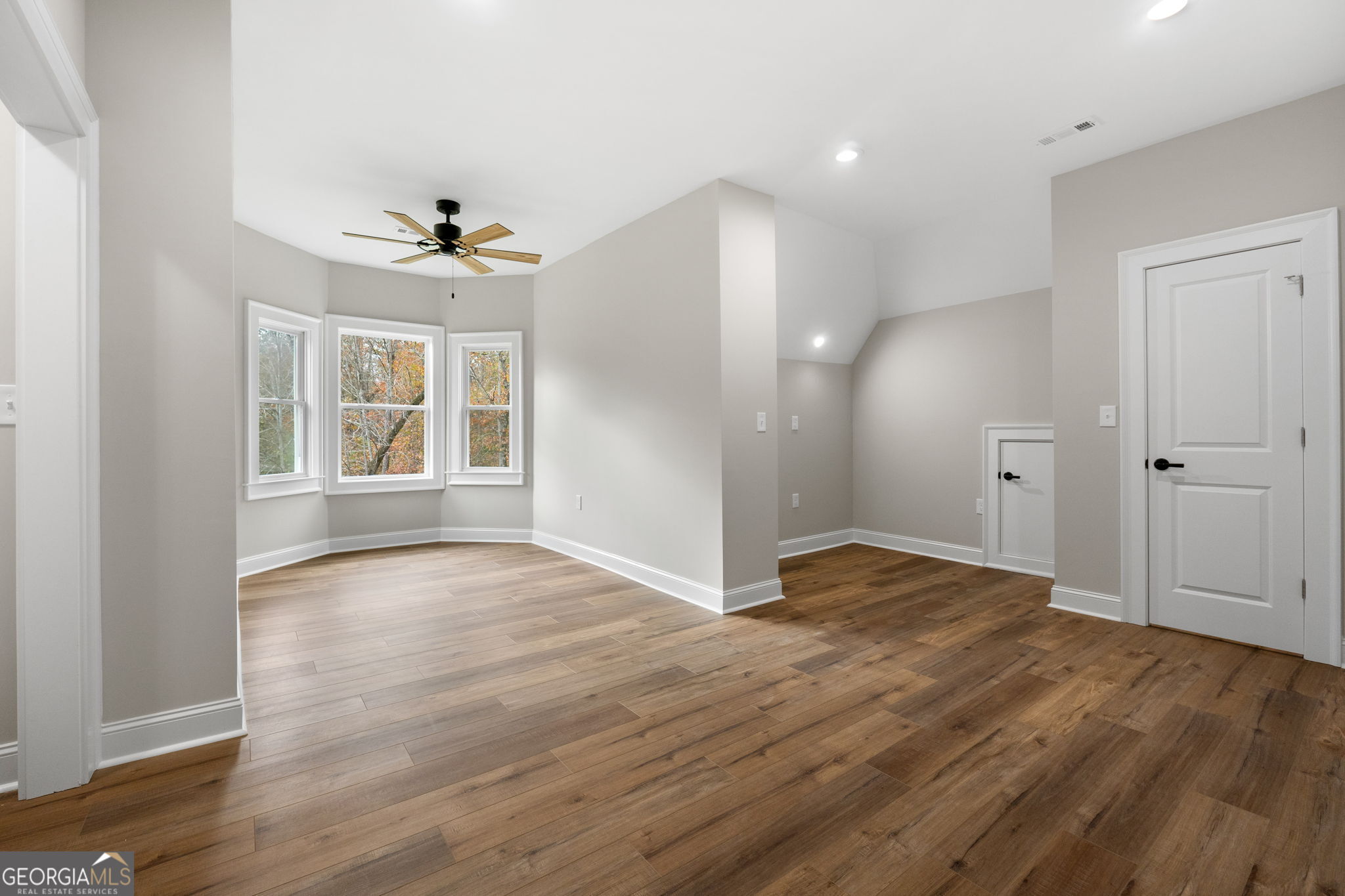 164 I I Walker Brooks Road Newnan, GA 30263 - Photo 49 of 54 a view of an empty room with window and wooden floor