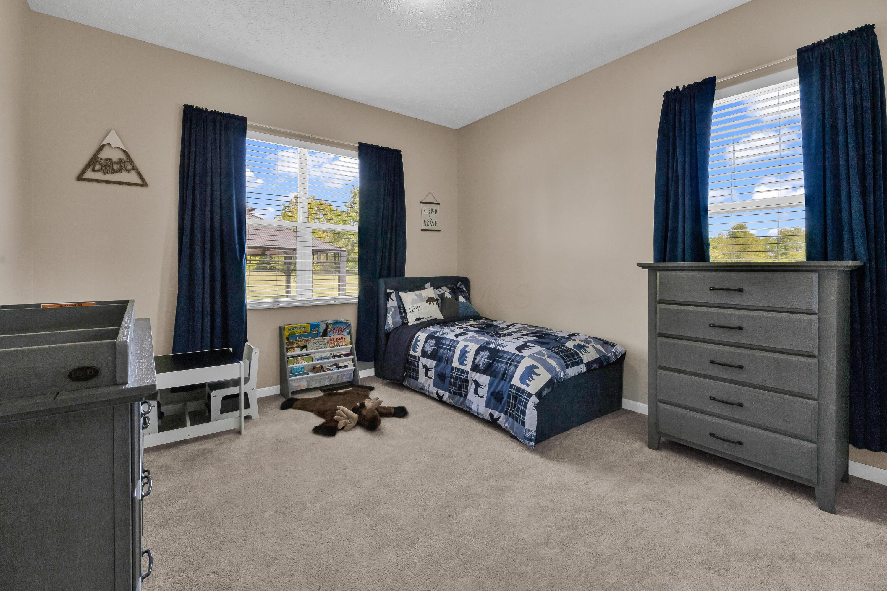 14396 Blamer Road Johnstown, OH 43031 - Photo 28 of 48 • Light sand carpet
• Tan painted walls
• Ceiling light
• Closet with double
sliding doors
• 2” blinds