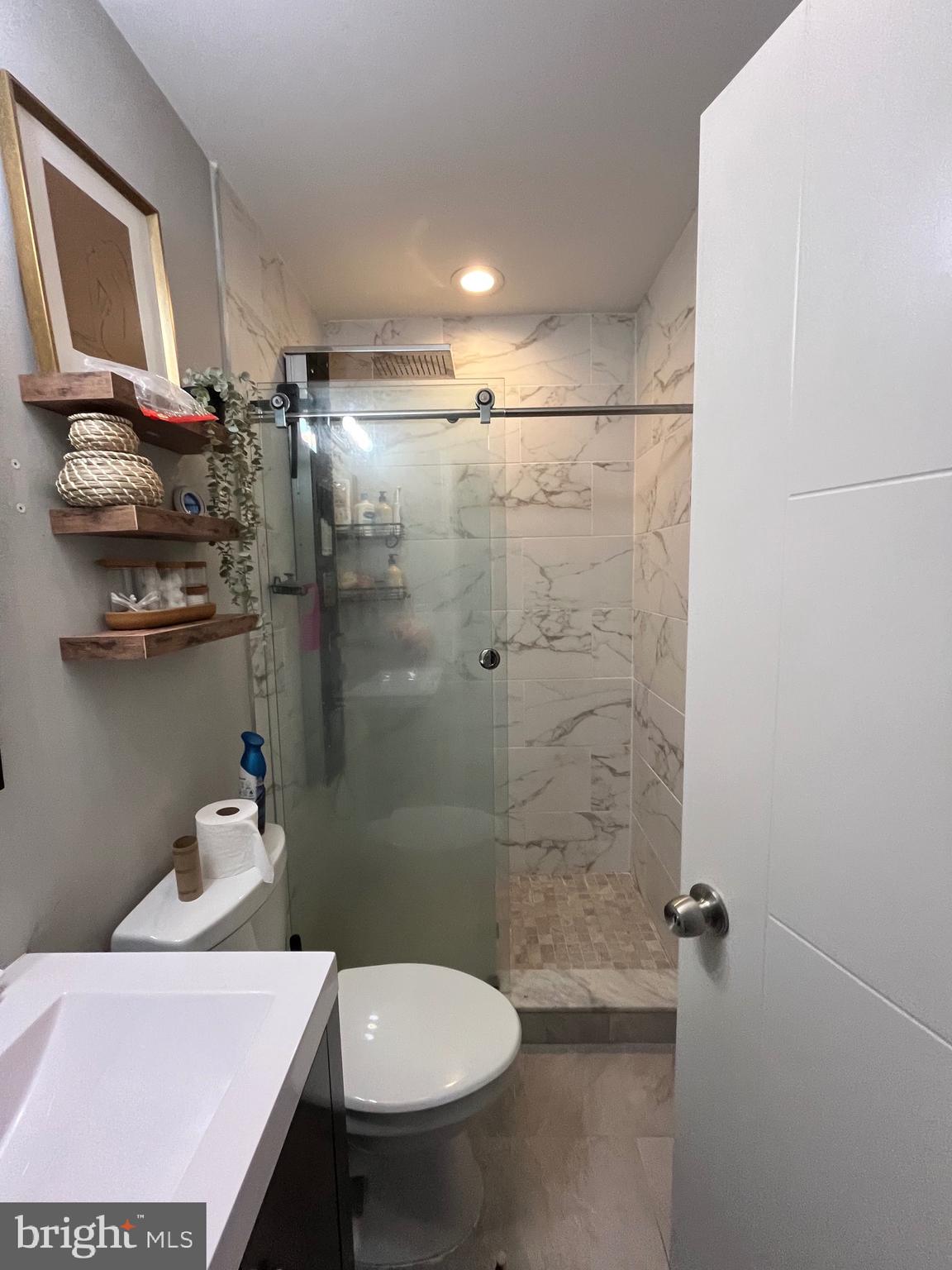 1625 Fontain Street Philadelphia, PA 19121 - Photo 13 of 24 a bathroom with a sink a toilet and shower