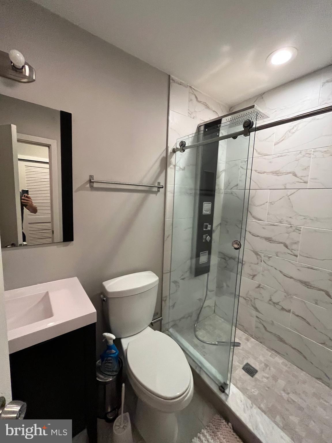 1625 Fontain Street Philadelphia, PA 19121 - Photo 14 of 24 a bathroom with a toilet a sink and shower