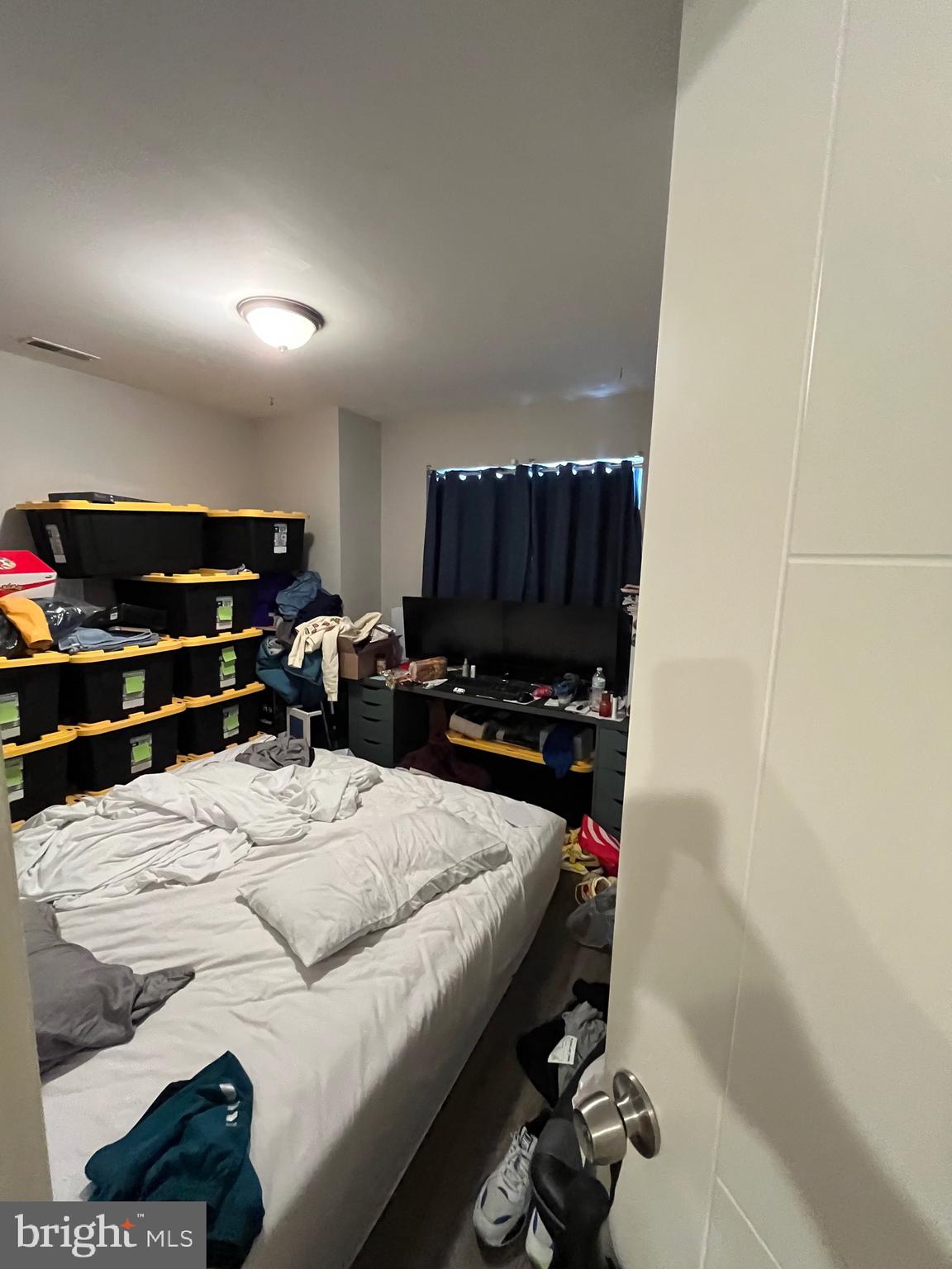 1625 Fontain Street Philadelphia, PA 19121 - Photo 21 of 24 a room with a bed and a television