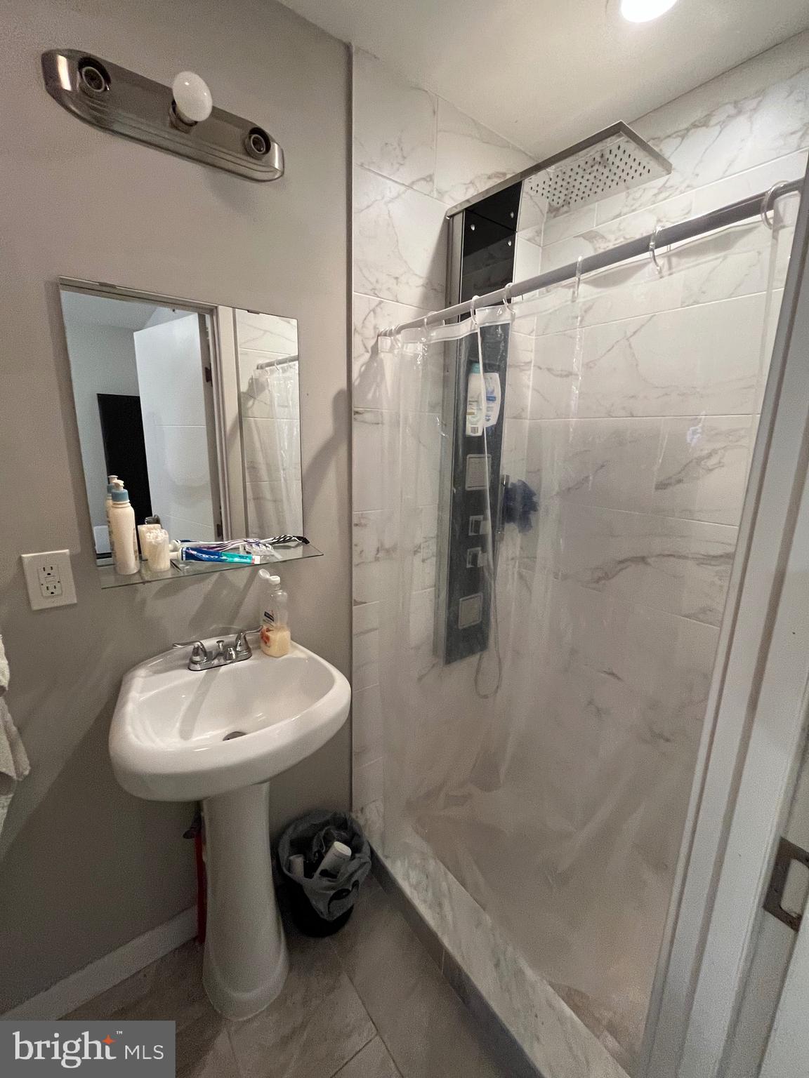 1625 Fontain Street Philadelphia, PA 19121 - Photo 23 of 24 a bathroom with a sink toilet and shower