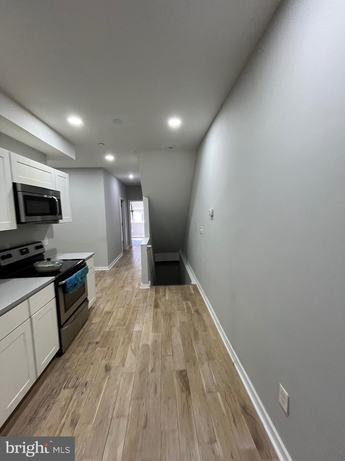 1625 Fontain Street Philadelphia, PA 19121 - Photo 5 of 24 a view of a kitchen with a sink and a stove top oven