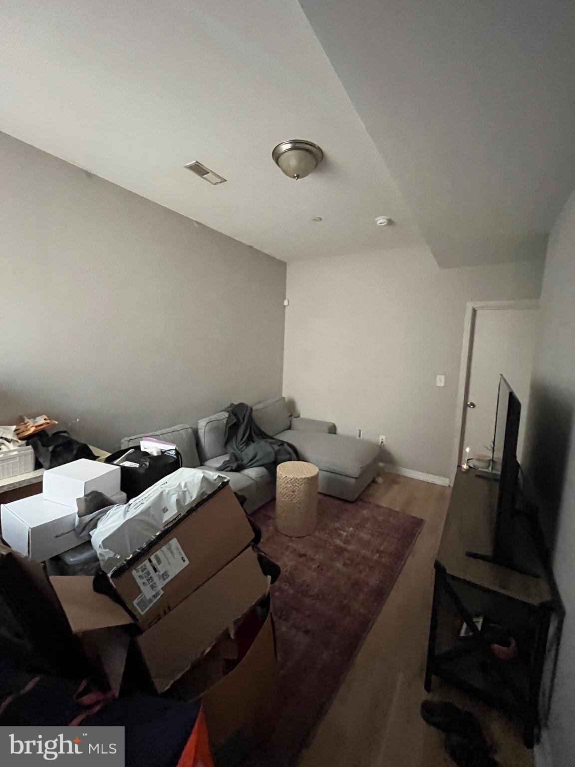 1625 Fontain Street Philadelphia, PA 19121 - Photo 10 of 24 a living room with furniture and a flat screen tv