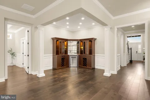 a view of an empty room with a kitchen