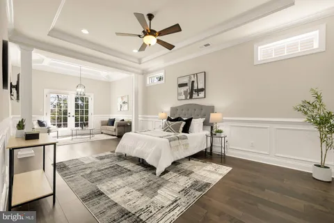a living room with a couch and a chandelier