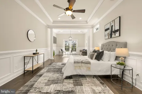 a bedroom with a bed a table and chair
