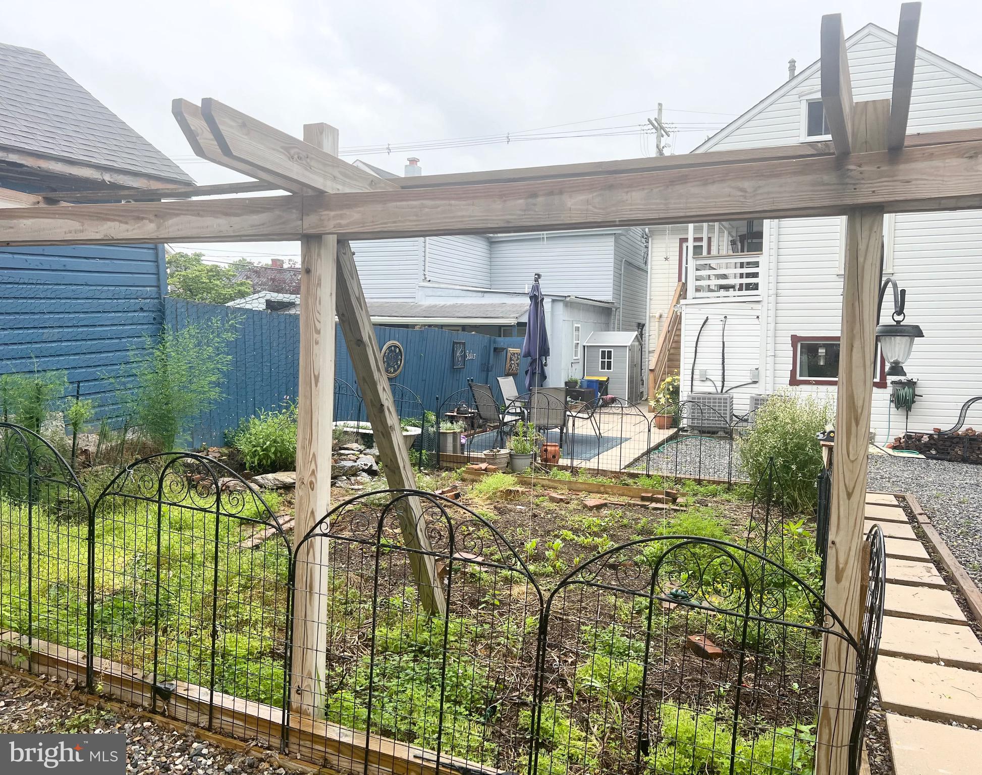 33 South Main Street Boonsboro, MD 21713 - Photo 31 of 34 a view of a patio with table and chairs potted plants with floor to ceiling window