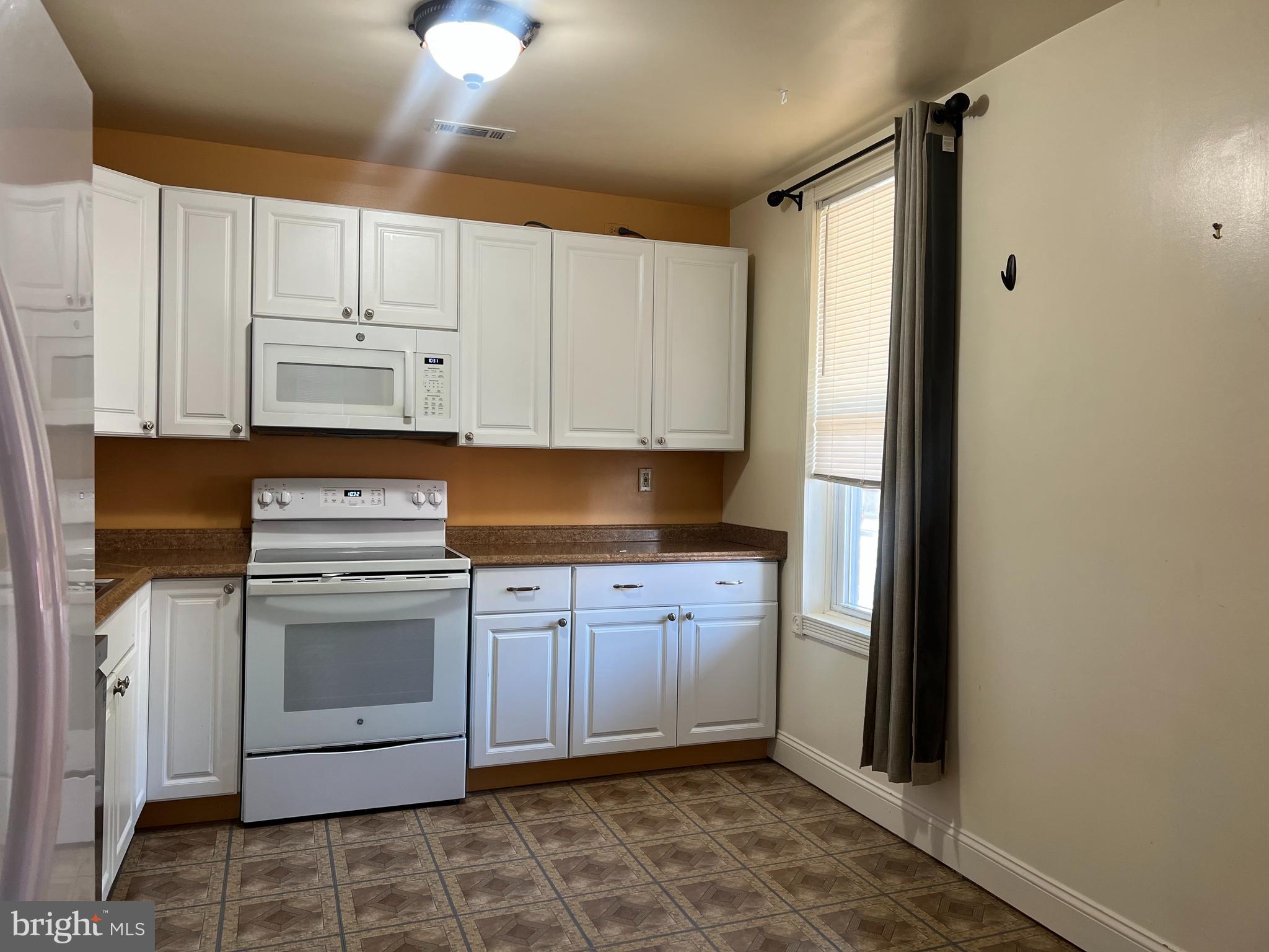 33 South Main Street Boonsboro, MD 21713 - Photo 6 of 34 a kitchen with stainless steel appliances granite countertop a refrigerator and a stove top oven