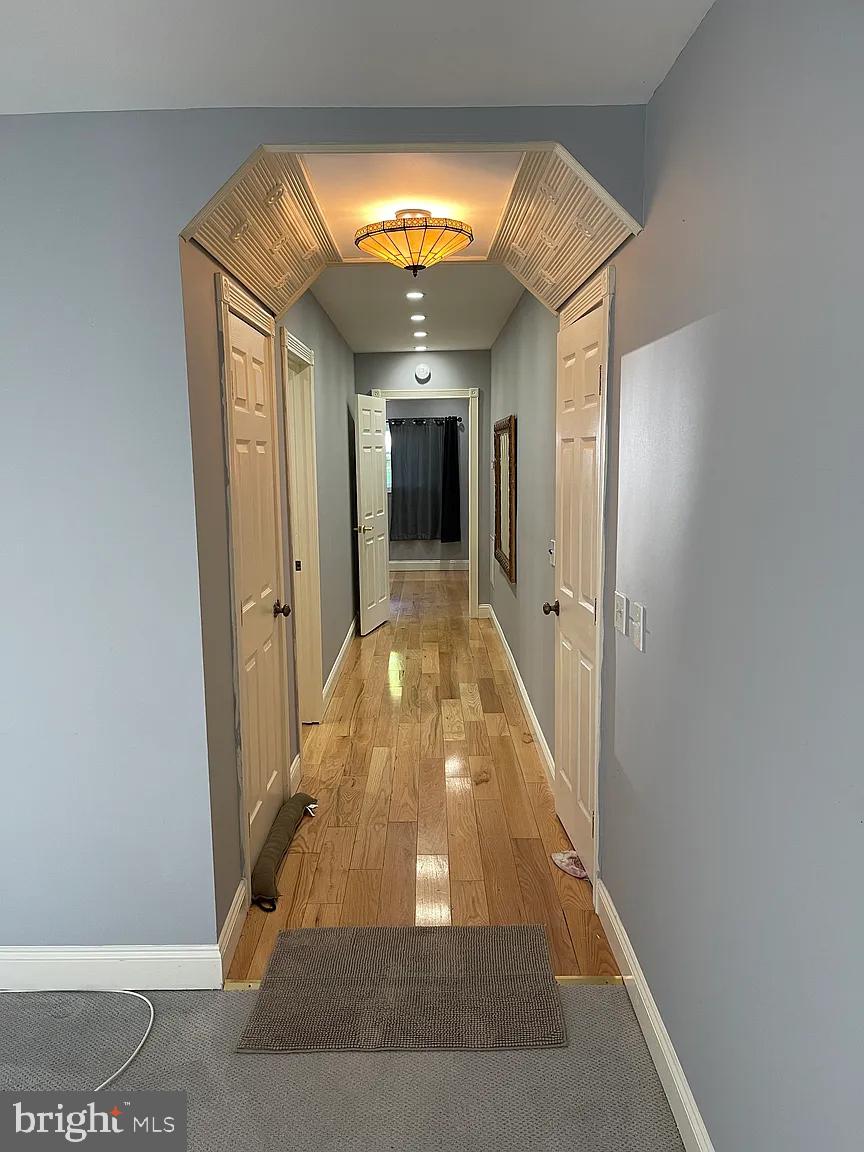 33 South Main Street Boonsboro, MD 21713 - Photo 7 of 34 a view of a hallway with wooden floor and staircase