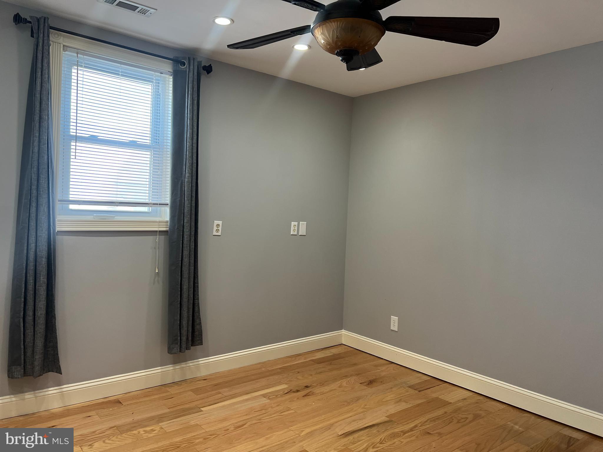 33 South Main Street Boonsboro, MD 21713 - Photo 10 of 34 an empty room with wooden floor and windows