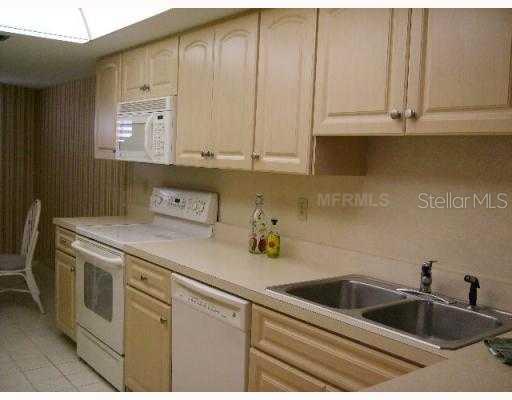8764 Midnight Pass Road, Unit A403 Sarasota, FL 34242 - Photo 6 of 10 Kitchen - Updated kitchen