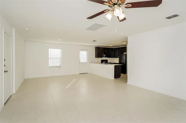 a view of a kitchen with a sink and a stove top oven