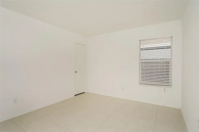 a view of a room that has a window in it