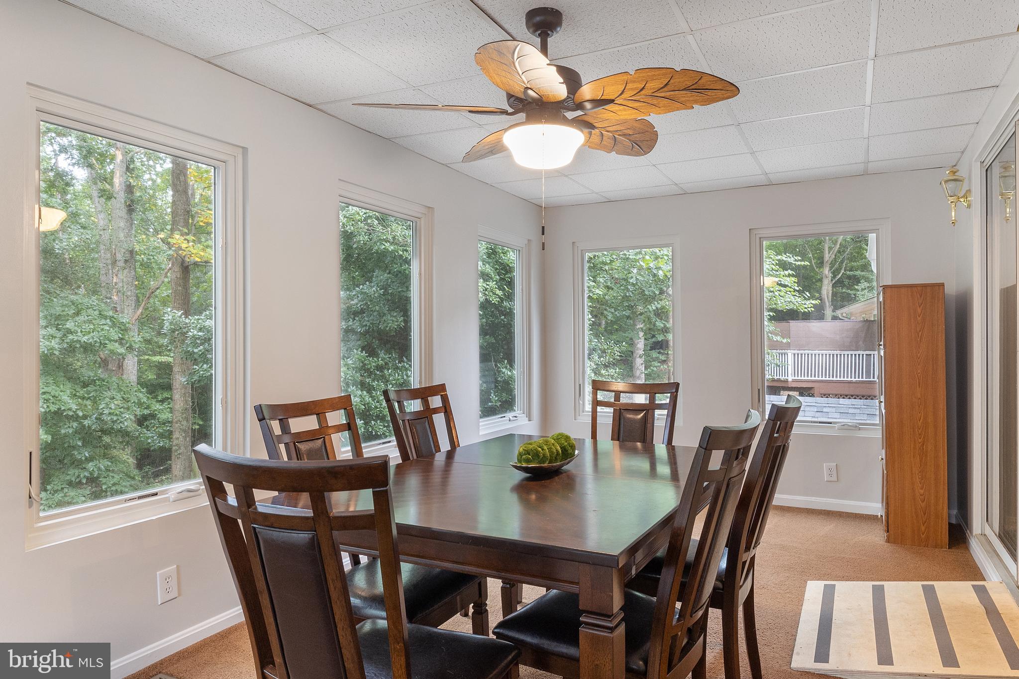 11316 Commanche Road Lusby, MD 20657 - Photo 13 of 68 a view of a dining room with furniture window and outside view