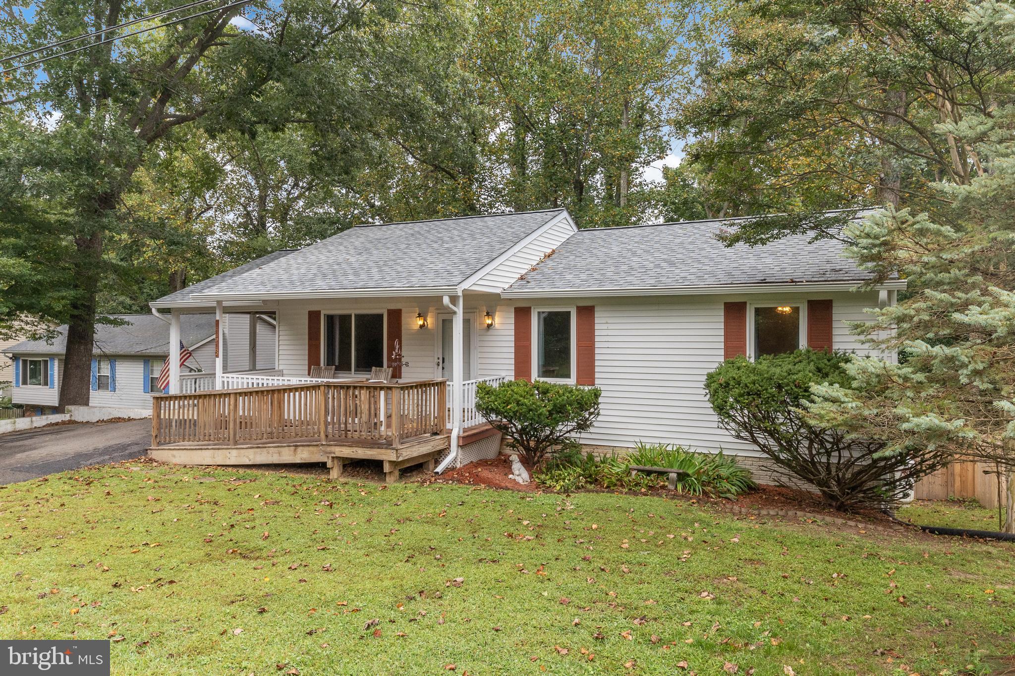 11316 Commanche Road Lusby, MD 20657 - Photo 47 of 68 a front view of a house with garden