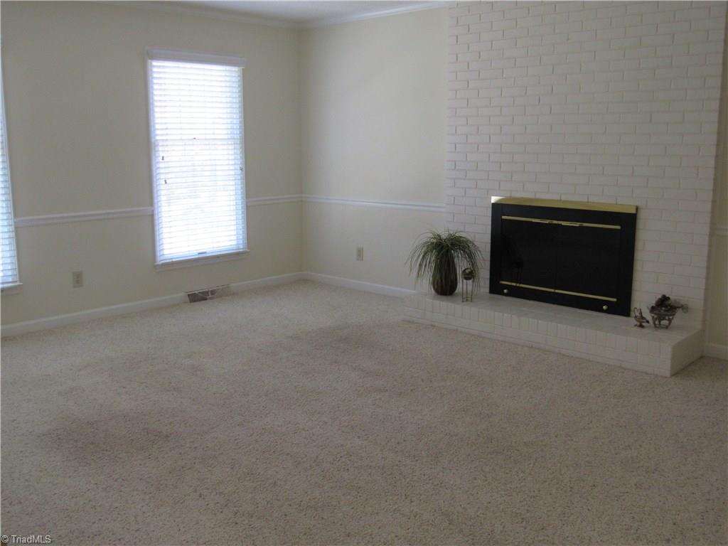 405 Traceway Road High Point, NC 27265 - Photo 9 of 23 Large Den with woodburing fireplace.