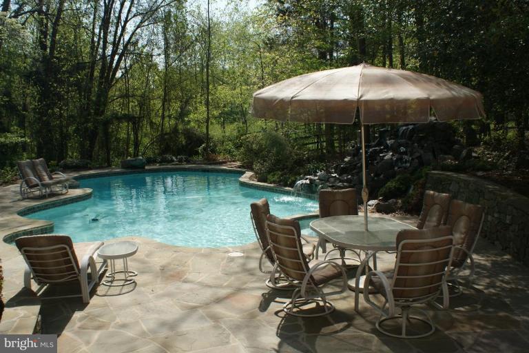 7396 Clifton Road Clifton, VA 20124 - Photo 8 of 30 The pool and surrounding patio
