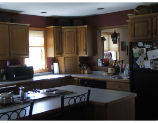 300 Scantic Road Hampden, MA 01036 - Photo 4 of 8 a kitchen with a sink a stove a refrigerator and cabinets
