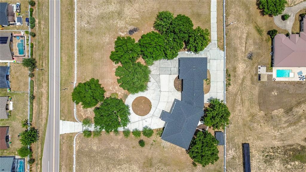 7925 Lake Mabel Loop Road Lake Wales, FL 33898 - Photo 4 of 97 an aerial view of a house with a yard