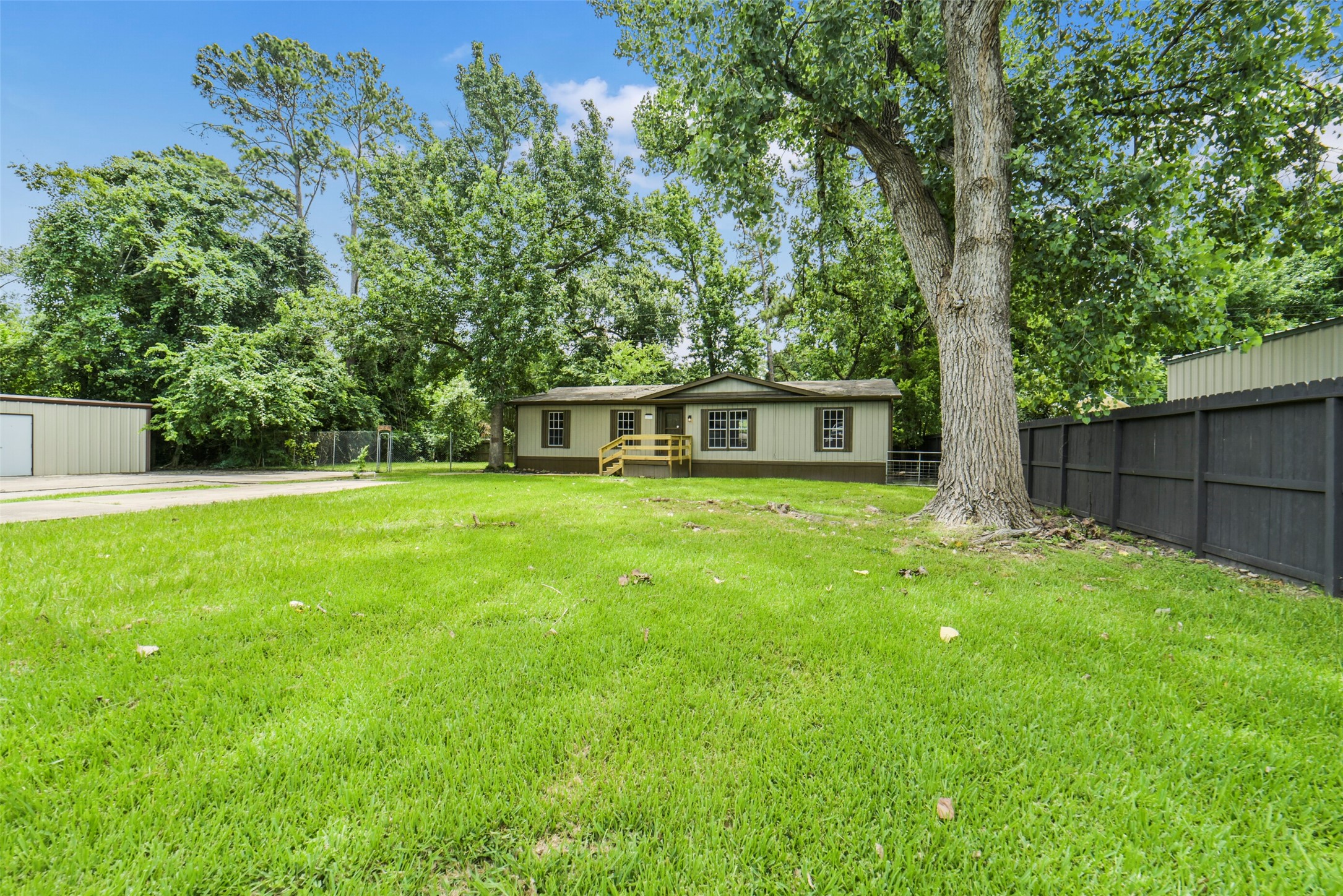 11023 Forrest Valley Drive Houston, TX 77065 - Photo 47 of 47 a house view with a sitting space and garden