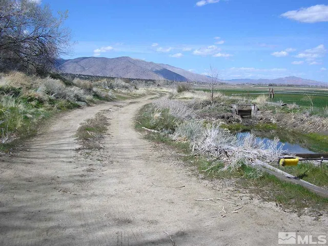 a view of lake with mountain in the background