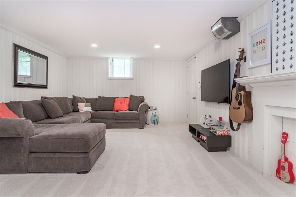 29 Brookfield Road Wellesley, MA 02481 - Photo 17 of 23 a living room with furniture and a flat screen tv