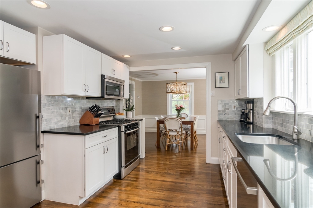 29 Brookfield Road Wellesley, MA 02481 - Photo 4 of 23 a kitchen with granite countertop a sink stove and cabinets