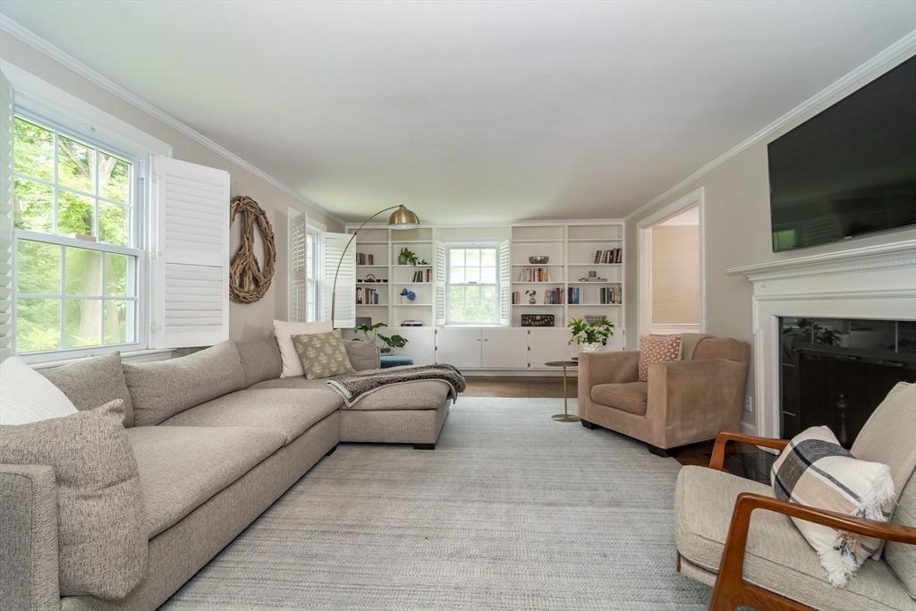 29 Brookfield Road Wellesley, MA 02481 - Photo 6 of 23 a living room with furniture and a flat screen tv