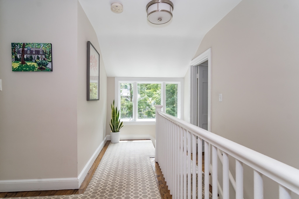 29 Brookfield Road Wellesley, MA 02481 - Photo 9 of 23 a view of a hallway with windows